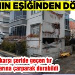 FACİANIN EŞİĞİNDEN DÖNÜLDÜ Tıra çarparak karşı şeride geçen tır, apartman duvarına çarparak durabildi